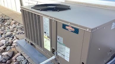 Heating and cooling unit installed outside.