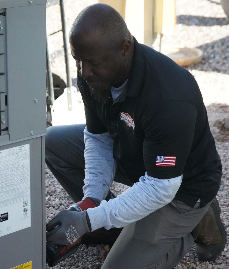 HVAC tech conducting maintenance to heater.