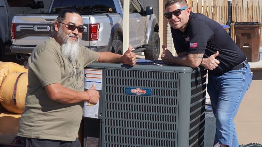 Semper techs standing in front of HVAC unit.