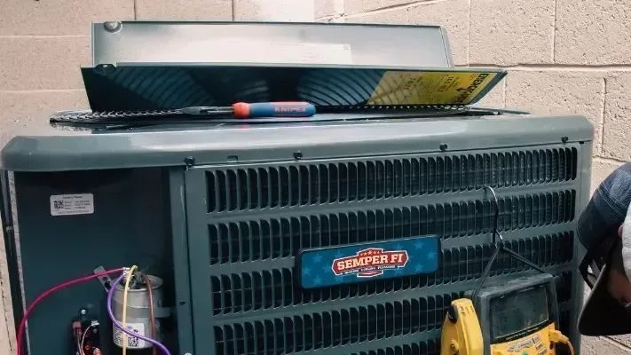 Air conditioning unit being repaired.