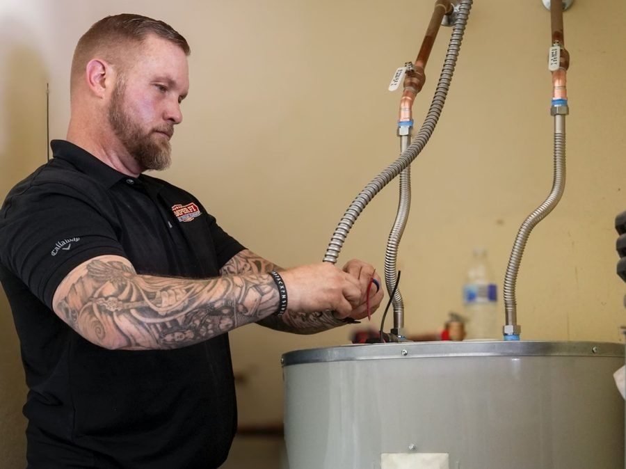 Semper Fi plumber addressing water heater.