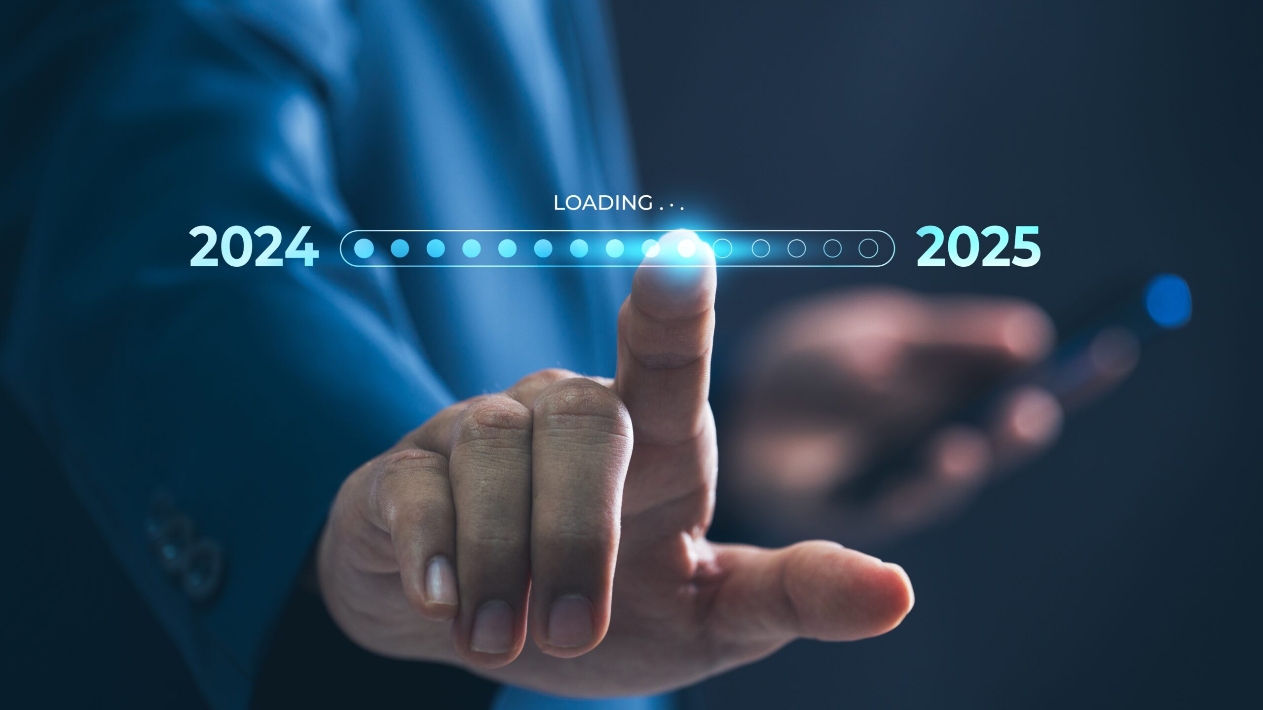 A businessman touches a digital progress bar indicating the transition from 2024 to 2025, symbolizing strategic planning, future readiness and challenge strategy for an HVAC Company